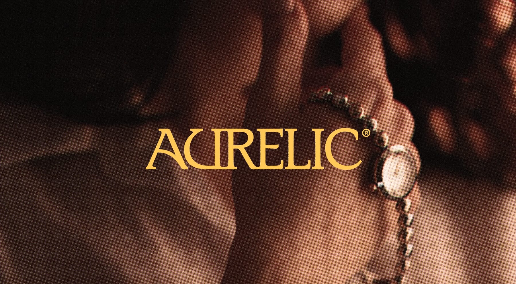Aurelic campaign, a beaded bracelet held in hand